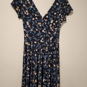 Beautiful dress with flowers in it.